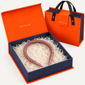 Silk headband presented in an orange and navy gift box with matching gift bag